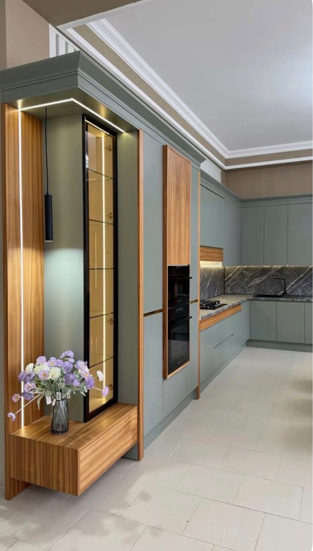 Sage green kitchen with oak accents